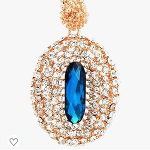 Rose gold toned, clear and blue crystal rhinestone pendant necklace